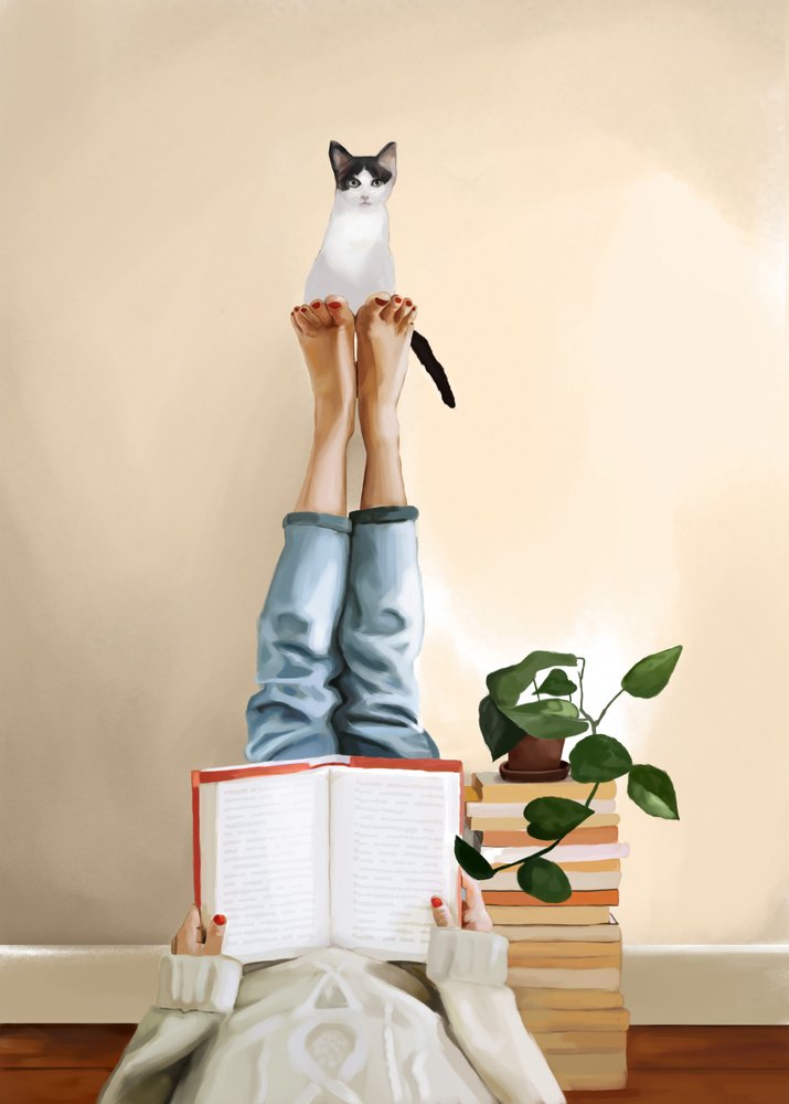 くつろぐ猫が本を読む 作： 
