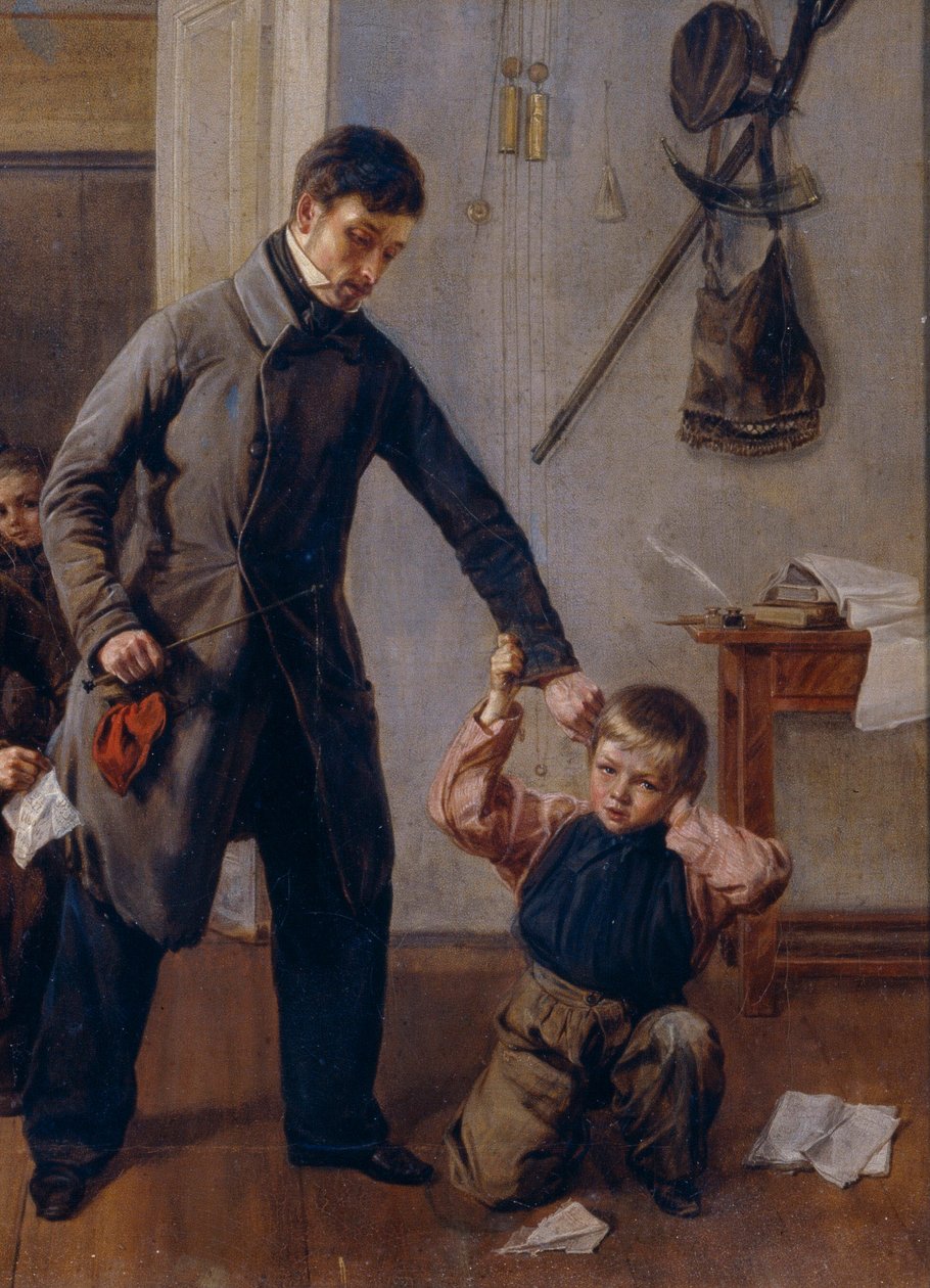 学校で。 田舎の学校の先生が教室で男の子の耳をつかみ、他