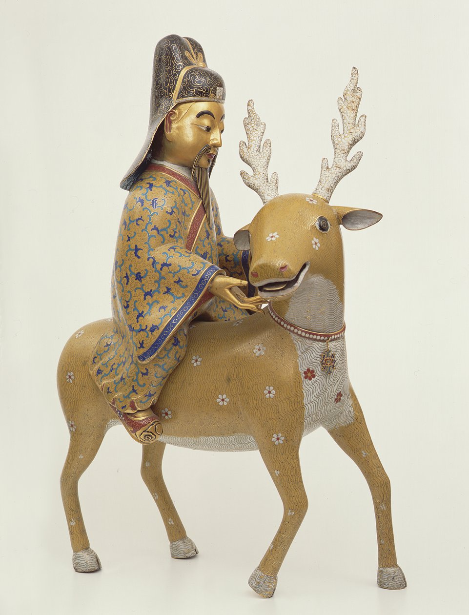 鹿に乗る不死身の像（七宝エナメル）