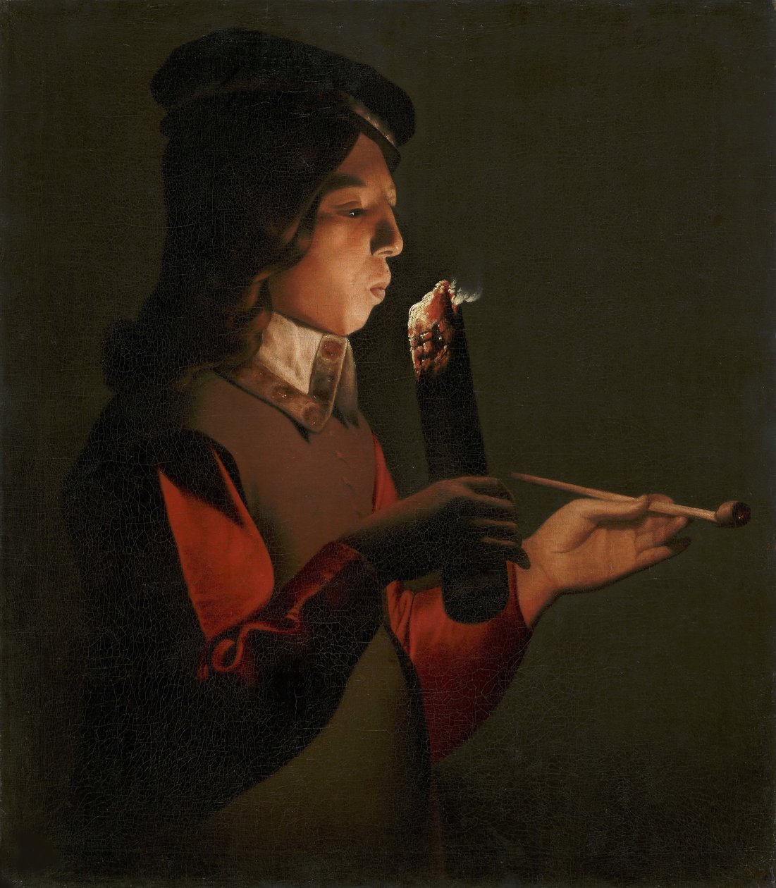 Un jeune garcon avec une pipe, souffle sur un brandon - ラ・トゥール、ジョルジュ、ド（1583-1652）の「パイプを持った若い少年が、火の粉を吹いている」。油彩・キャンバス 作： ジョルジュ・ド・ラ・トゥール