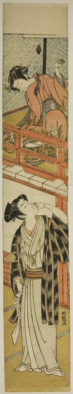 若い男にボールを投げる若い女性 作： Is田流彩