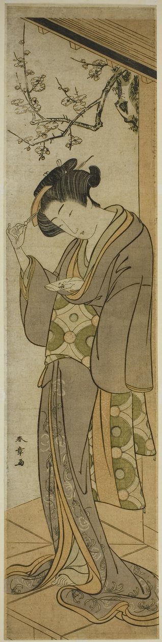 ベランダで手紙を開けようとしている女性 作： 勝川春章