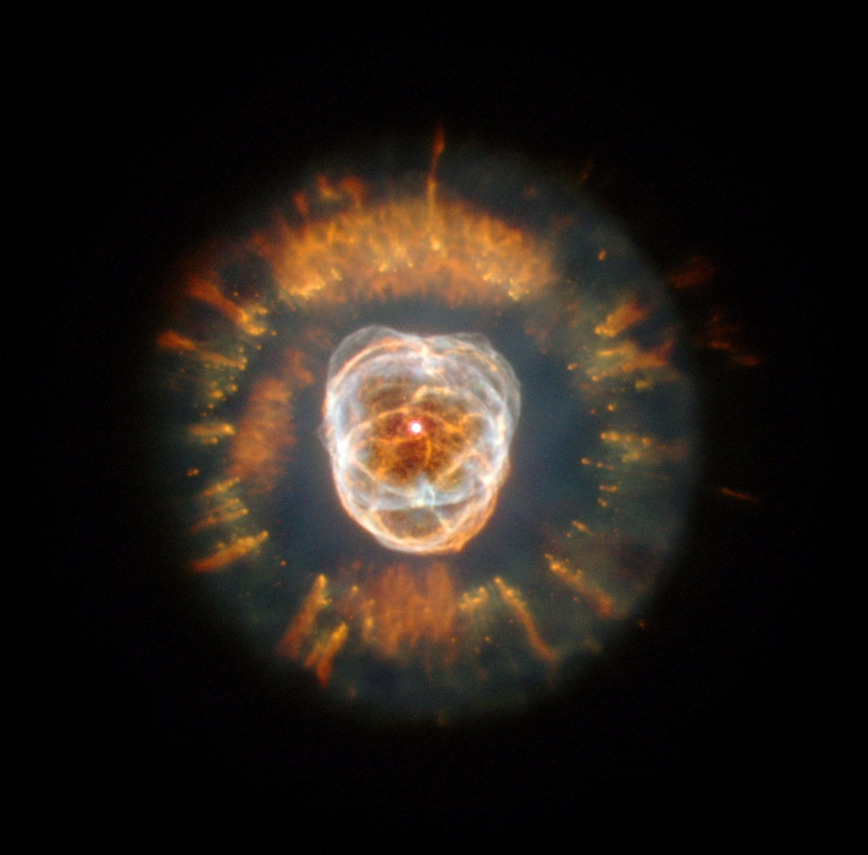 1787年にウィリアムハーシェルによって発見された惑星状星雲であるエスキモー星雲。2000年にハッブル望遠鏡は、まだ完全には理解されていない複雑なガス雲を表示する星雲を画像化しました。クレジットNA 作： 全米航空宇宙局全米航空宇宙局