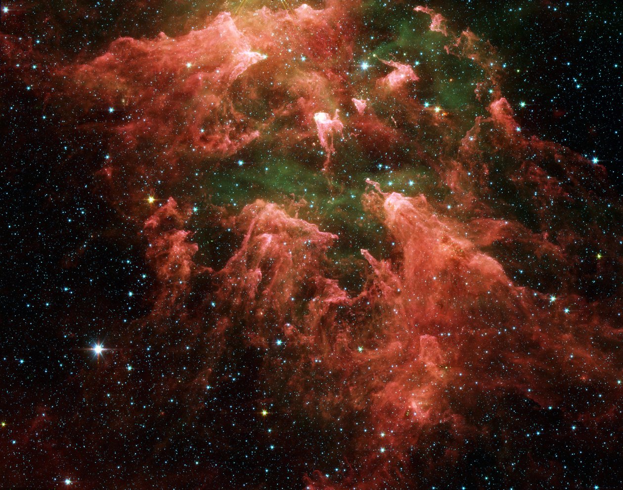 カリーナ星雲と呼ばれるツァーリ形成領域の南柱領域のスピッツァー宇宙望遠鏡の偽色画像。厚いほこり（ピンク）の指のような柱の中の星の胚（黄色または白）。ホットg 作： 全米航空宇宙局全米航空宇宙局
