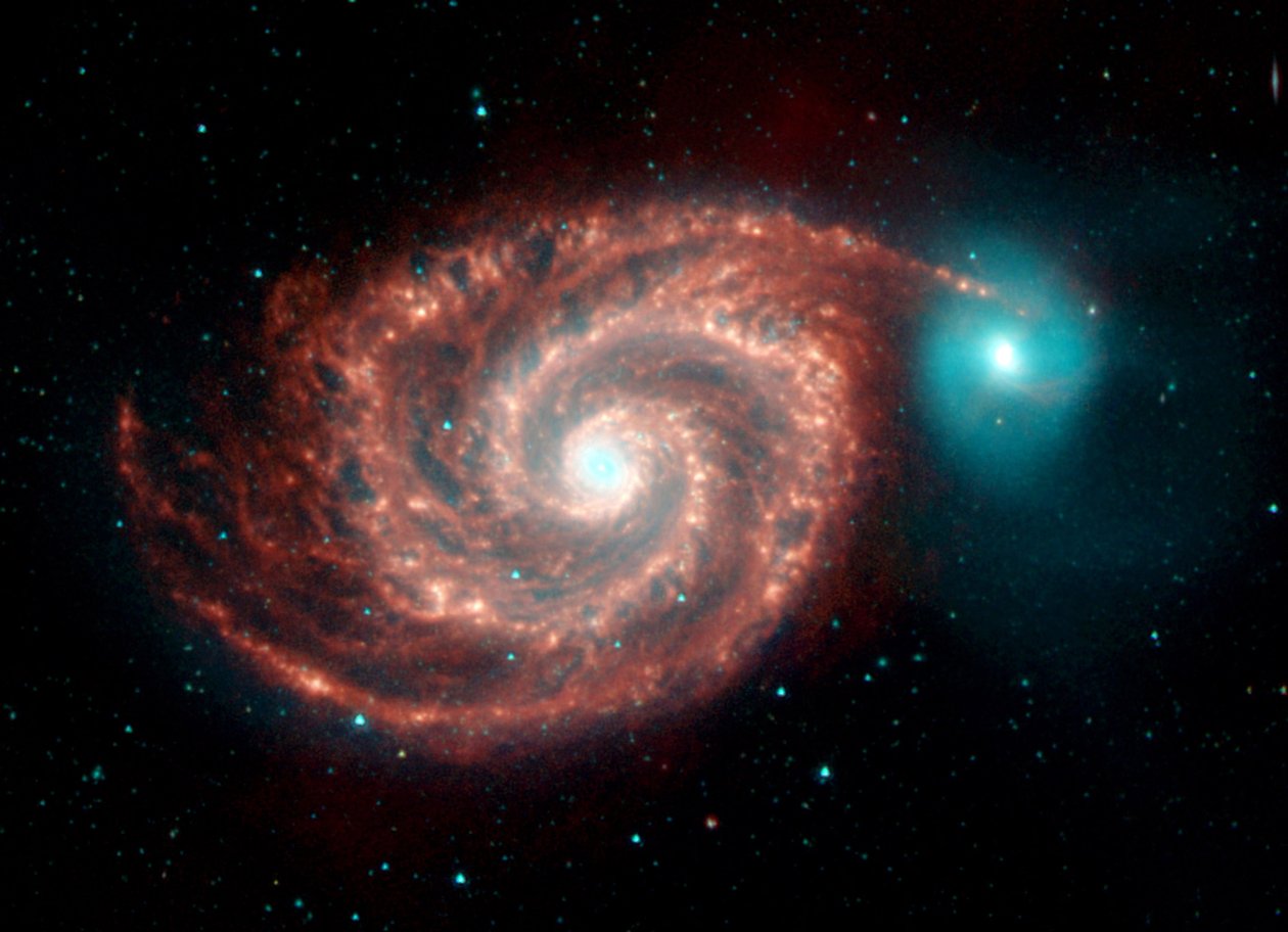 ワールプール銀河のスピッツァー宇宙望遠鏡の赤外線画像。奇妙な構造は、塵の多い渦状腕の間のギャップを埋め、明るい渦巻銀河内の塵、ガス、恒星の個体群を示します。 Cr 作： 全米航空宇宙局全米航空宇宙局