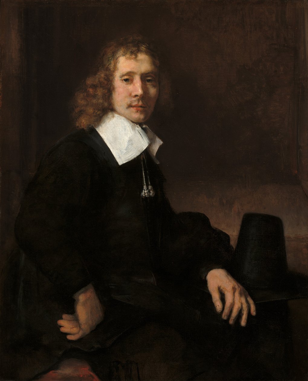 テーブルに座っている若い男、おそらくGovaert Flinck、c。 1660年。 作： レンブラント・ファン・レイン