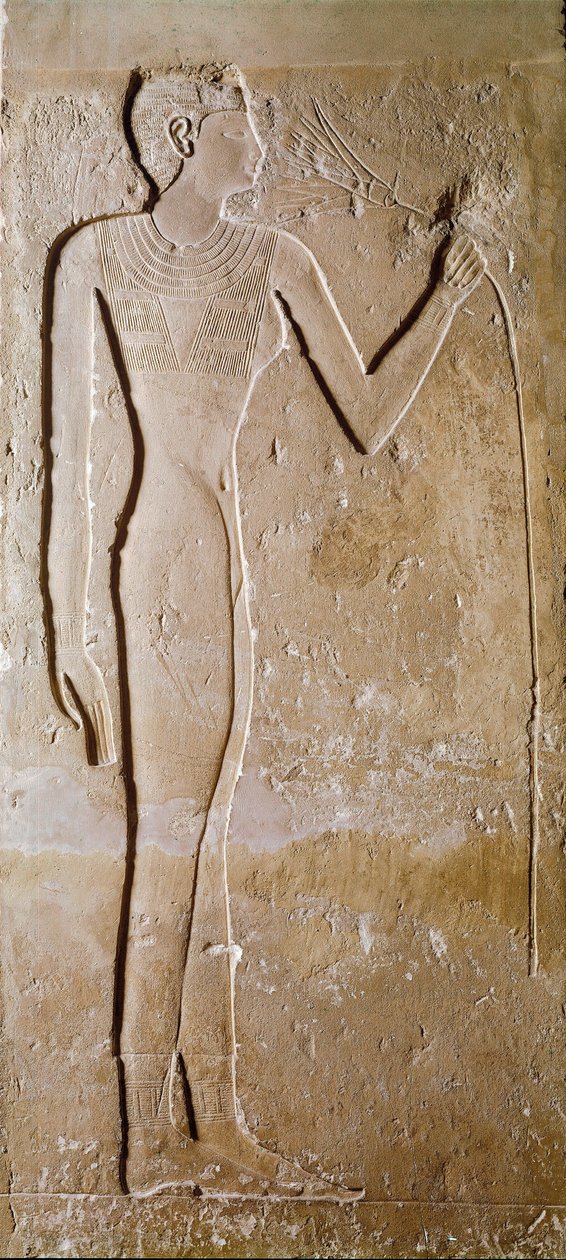 エジプトのアンティーク：若い女性が蓮の花を持っています。石灰岩。第