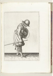 盾とスパイクを使った演習: 兵士は右足の隣の地面にスパイクを置きます (No. 16), 1618 Nassausche Wapen-Handelinge、van Schilt、Spies、Rappier ende Targe : 人物によって描かれ、[の] 新しい秩序に従ってポーズをとった (...) M 作： Adam van Breen