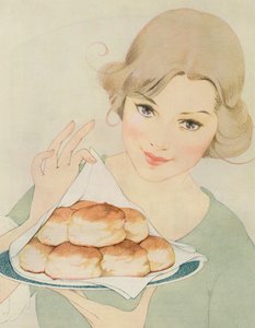 温かいビスケットを提供する女性