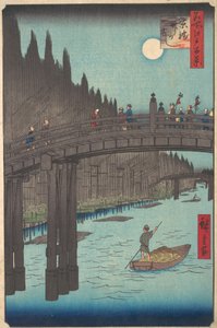 運河に架かる満月、堤防沿いに橋と巨大な竹の山がある、1920 年頃。 1857年頃。 1857年。 作： Ando Hiroshige
