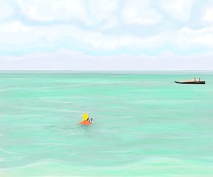 海で犬と泳ぐ女性