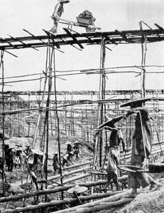 世界で最も豊かなスズ地区、中国のタイピンでの原始的な方法、1936年。 作： Ewing Galloway