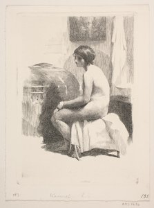 部屋に座っている裸の女性モデル
