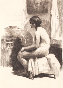 部屋に座っている裸の女性モデル