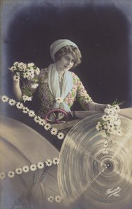 花をたくさん持ち、工場で働く若い女性（色付きフォトコラージュ） 作： French Photographer