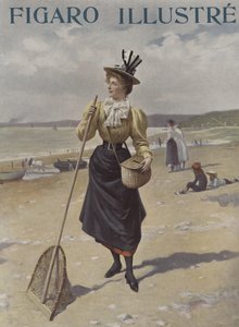 釣り道具を運んでいる浜辺を歩く女性