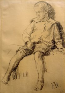 裸足で座っている少年