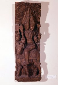 火の神アグニは、ヒンドゥー神話では雄羊の上に2つの頭（バイセファル）を持っているとされています。17世紀の木彫。パリ、ギメ美術館。 作： Indian School