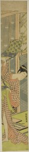 絵を掛ける若い女性 作： Isoda Koryusai