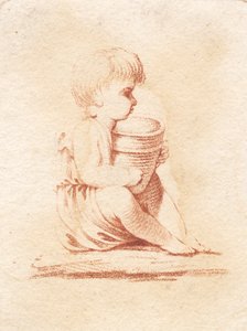 座っている小さな男の子