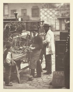 通りの鍵屋、1881 年。 作： John Thomson