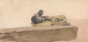 横たわる少年