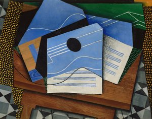 テーブルの上のギター 作： Juan Gris