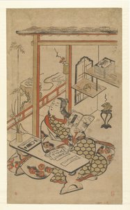 テーブルで源氏物語を読んでいる女性。