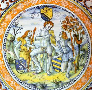イタリアの陶器の皿には、2人の羊飼いに配管するパンが描かれています。 作： Maestro Benedetto