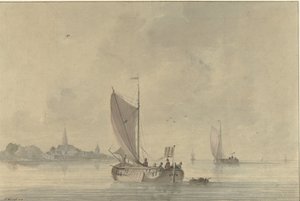 オランダの町の前の水上を航行するはしけ
