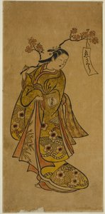 満開の桜の枝を運ぶお七
