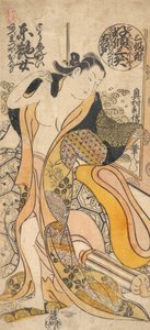 服を脱ぐ女性。
