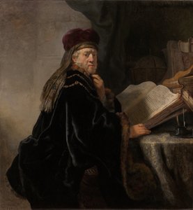 彼の研究で机の学者に着席した学者 作： Rembrandt van Rijn