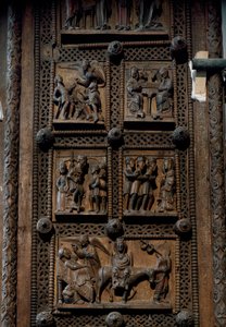 ロマネスク美術：ドイツ・ケルンのカピトルの聖マリア教会（Sankt Maria im Kapitol, Koln）の12世紀中頃の木製扉。羊飼いたちへの告知、キリスト降誕、魔術師の崇拝、キリストの誕生を描いたシーン。