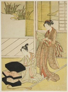 若い女性に商品を見せるうちわの行商人 作： Suzuki Harunobu