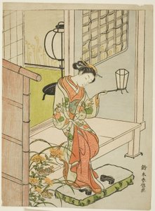 提灯を持って出かける女性