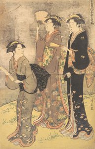隅田川のほとりを散歩する3人の若い女性。