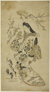梅の木の近くを歩く若い女性