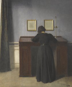 机に立っているアイダ 作： Vilhelm Hammershøi