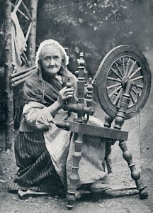 1912年、紡ぎ車に乗るアイルランドの老婆 作： W. Lawrence