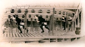 伝統的な日本の演劇: 機械工がステージの回転台を操作します 作： Yoshimune Arai