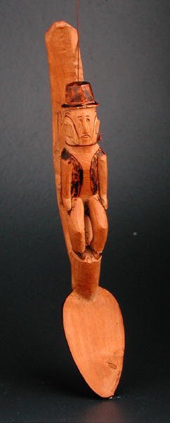 スプーンの軸に座るヨーロッパ人男性の図 南東アフリカ 19世紀後半 (木製) 作： African