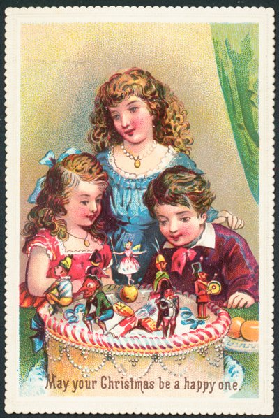 クリスマスケーキ、クリスマスカードを見て子供たち 作： English School