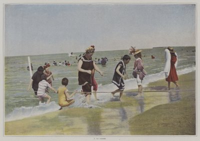 海岸でロープを使って遊ぶ子供たち（カラー写真 作： French Photographer