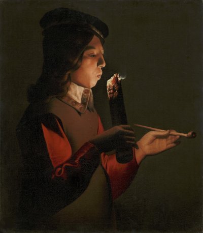 Un jeune garcon avec une pipe, souffle sur un brandon - ラ・トゥール、ジョルジュ、ド（1583-1652）の「パイプを持った若い少年が、火の粉を吹いている」。油彩・キャンバス 作： Georges de La Tour