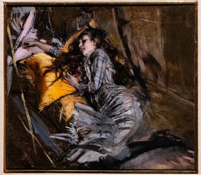 タータン チェックのドレスでリクライニングの女の子 作： Giovanni Boldini
