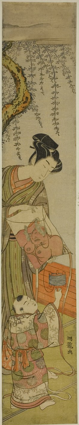 若い男が子供のために凧を持っている 作： Isoda Koryusai
