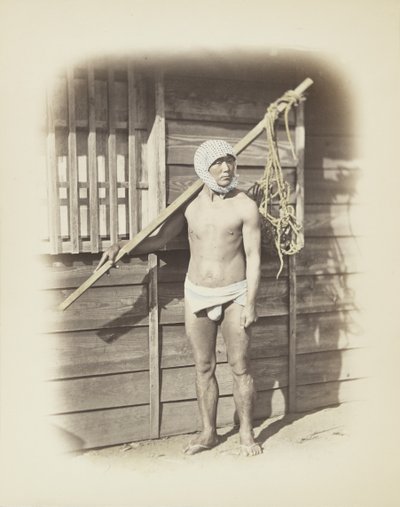 釣りかごを持った男性（手彩色のモノクロ写真 作： Japanese Photographer