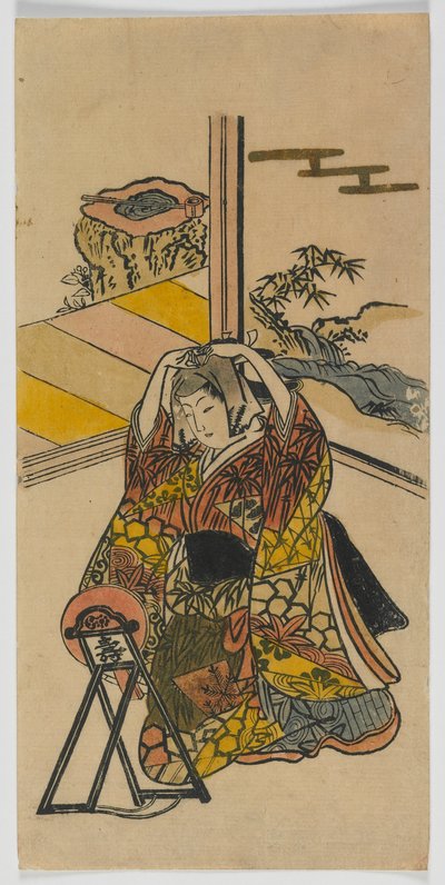 鏡の横にひざまずく若い女性、江戸時代、1720年代（カラー木版画） 作： Japanese School