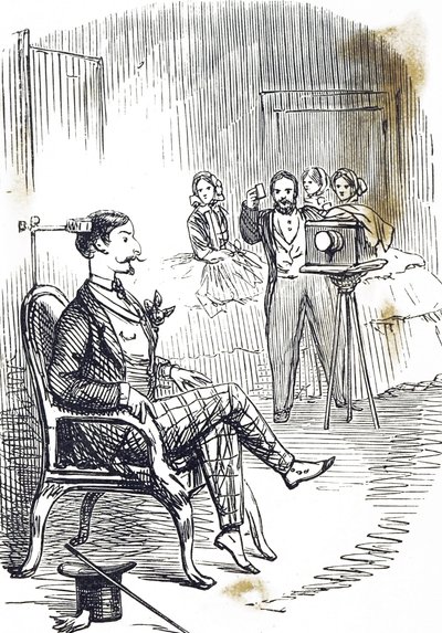 被写体を固定するための頭部固定具を描いた漫画 作： John Tenniel